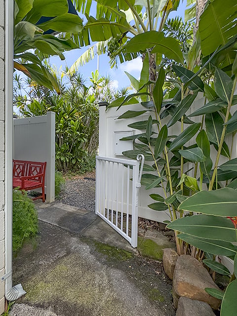 this gateway leads from off-street parking to the front door. the 6 foot fence provides privacy in the yard.