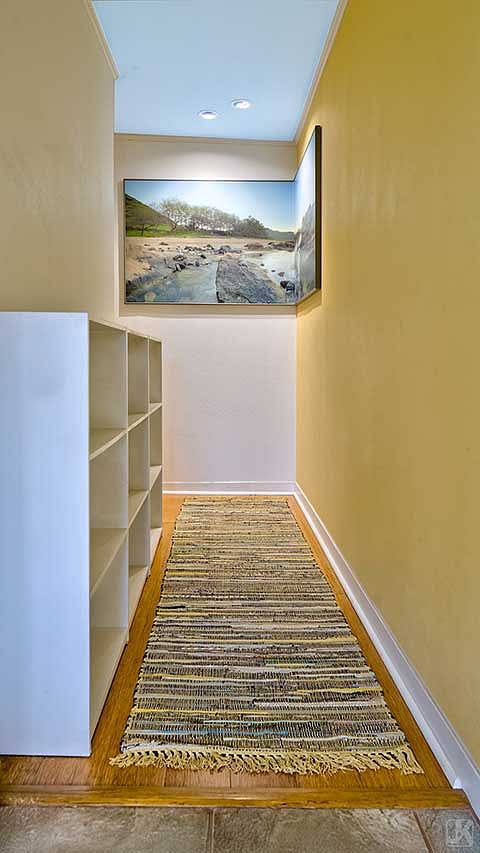 Plentiful storage and unique artwork greet you in the entry hallway.