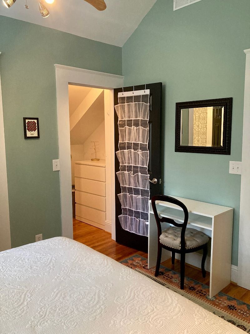 Walk-in closet and desk.
