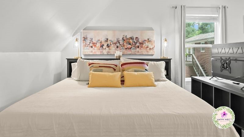 A luxurious king-sized bed with storage in the headboard