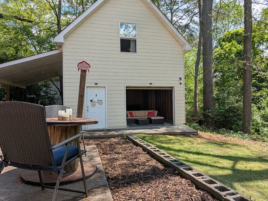 Enjoy the spacious back yard.  This is the exterior view of the garage apartment.  