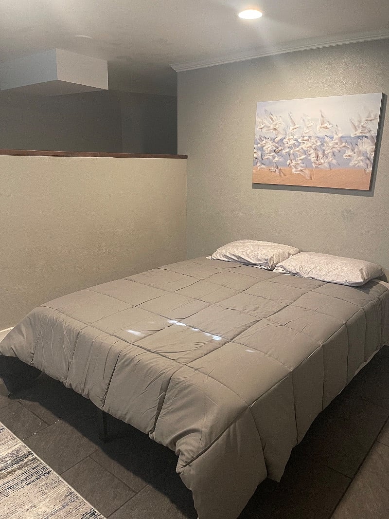Larger bedroom. Full size bed.