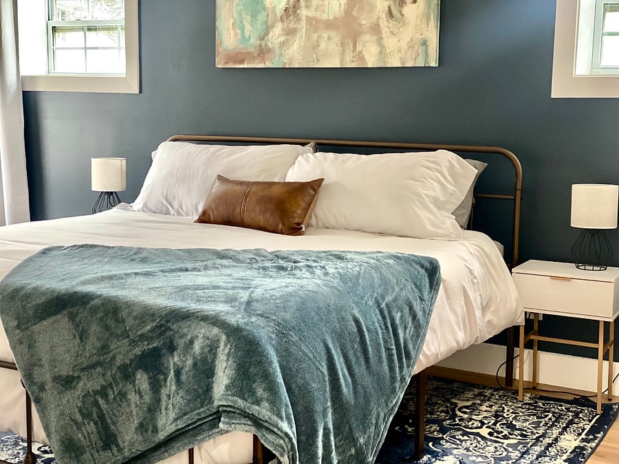 King master bedroom. Most recent image with rug under the bed.