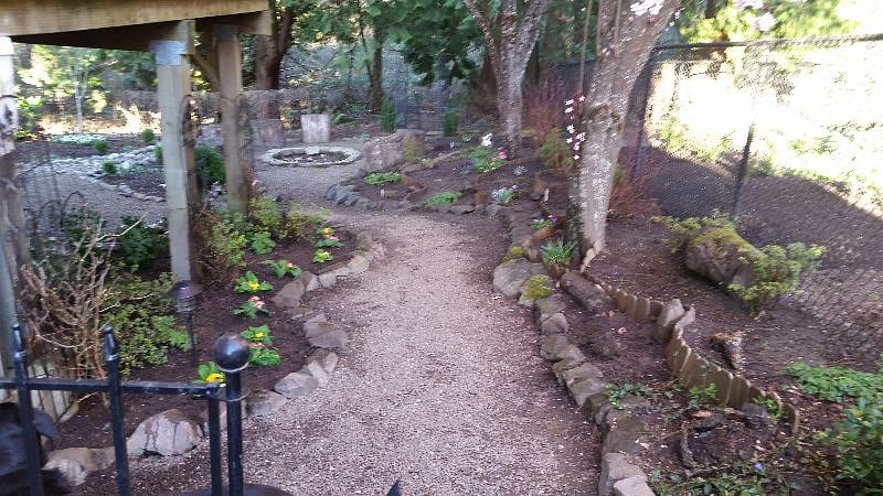 Backyard with pea-gravel pathways