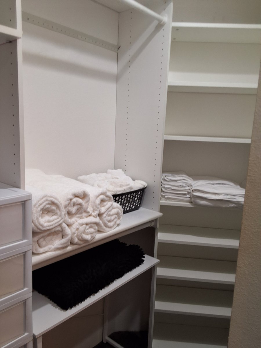 Primary bedroom walk-in closet