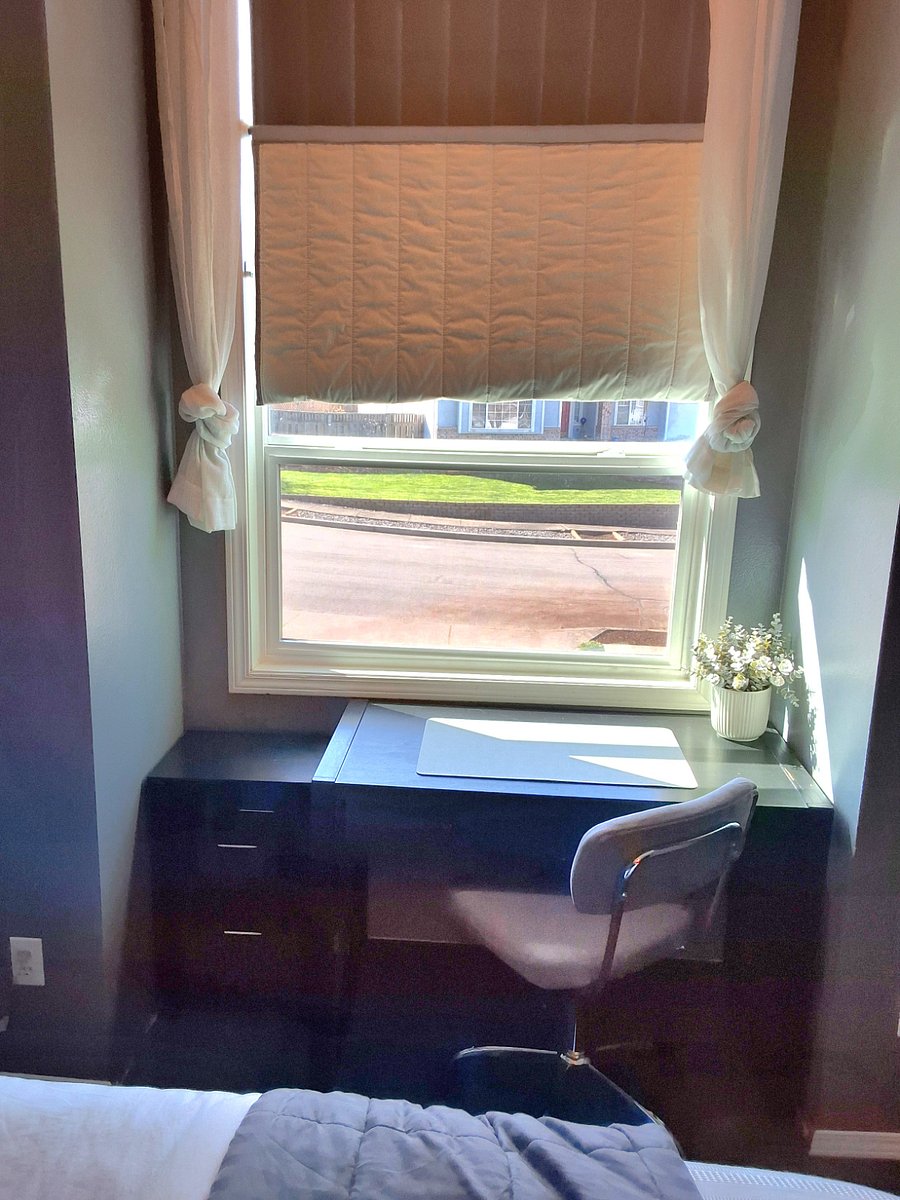 Second bedroom desk and large west-facing window