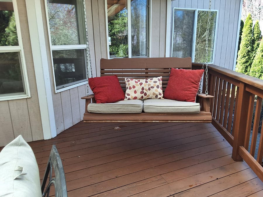 Porch swing on redwood deck