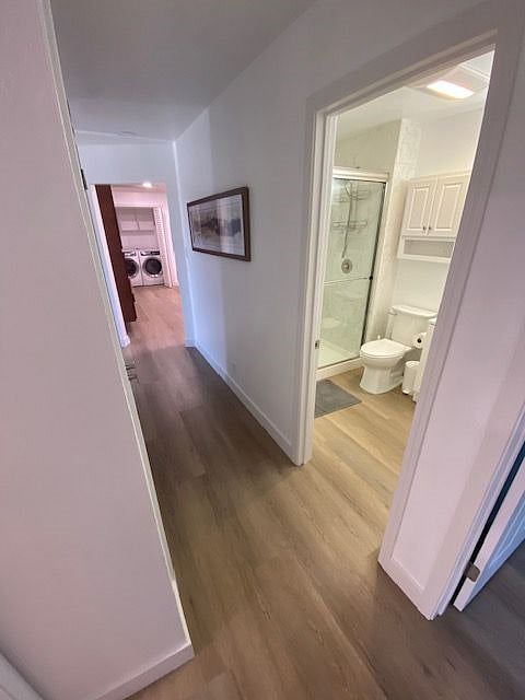 View of shared bath for Unit B and C - view from private bedroom across hall