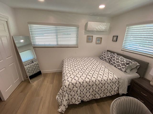 Room from desk wall- 2 large windows to let in plenty of natural light