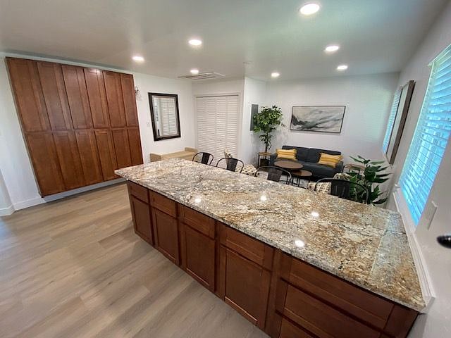 View of family room and pantry from back of kitchen