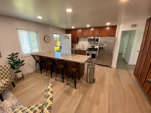 View of kitchen from family room/laundry area