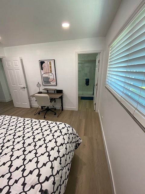 view of room leading to private bath