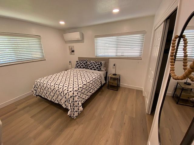 view of room looking to back wall from bedroom door- closet on wall on right