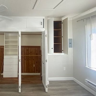 Floor to ceiling storage space.  It can include a working table and tuck away when not needed. 
 Available per request.