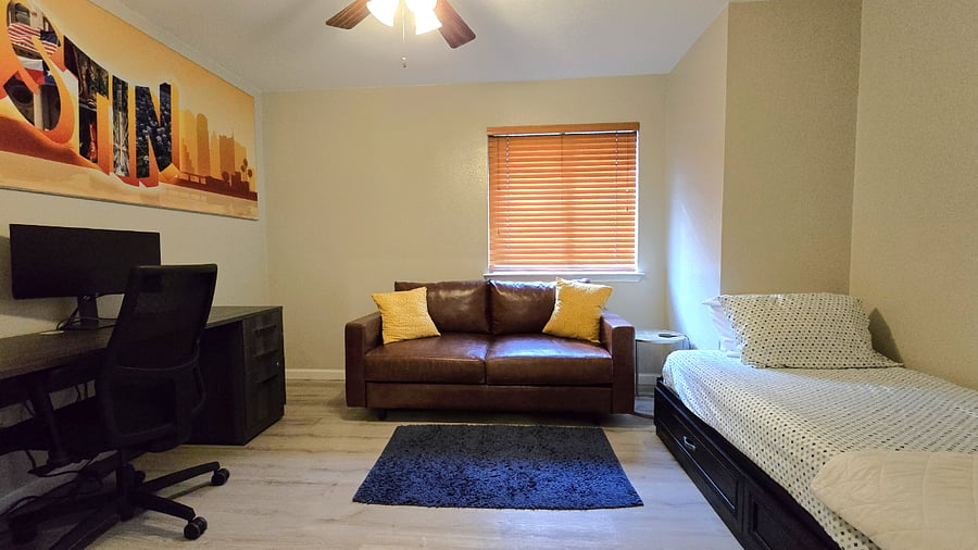 Bedroom 4 with twin bed, work station and couch