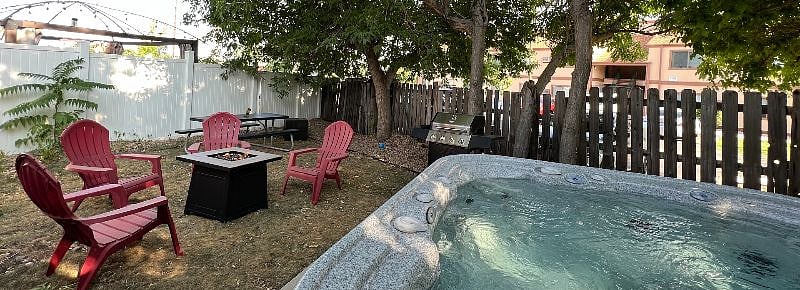Our property is a true escape with a hot tub, firepit, outdoor seating, and a BBQ grill  the ultimate recipe for a perfect getaway!