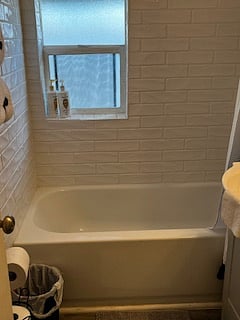 Shower tub and newly renovated bathroom