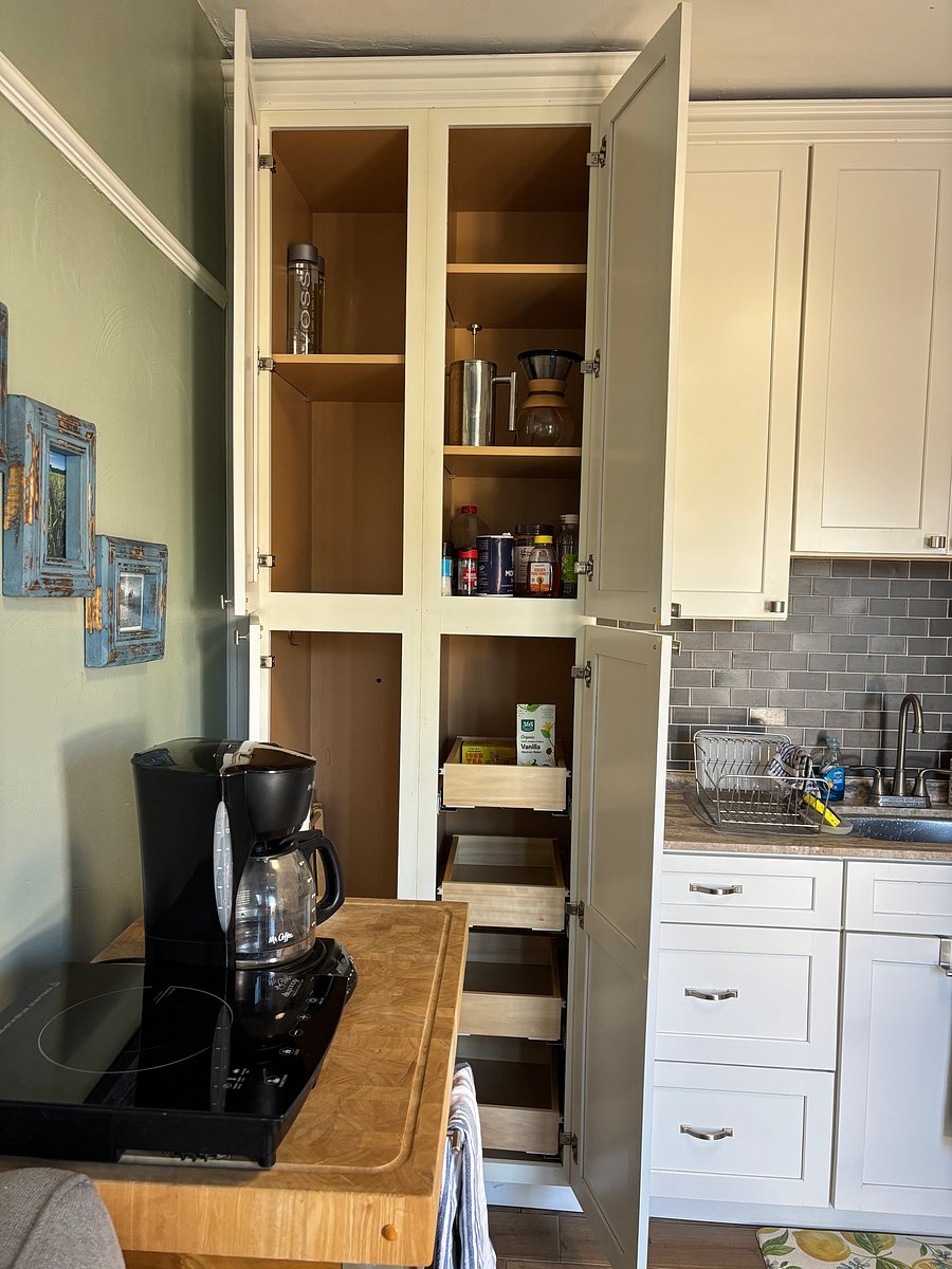 Lots of storage in cabinet to the left of sink