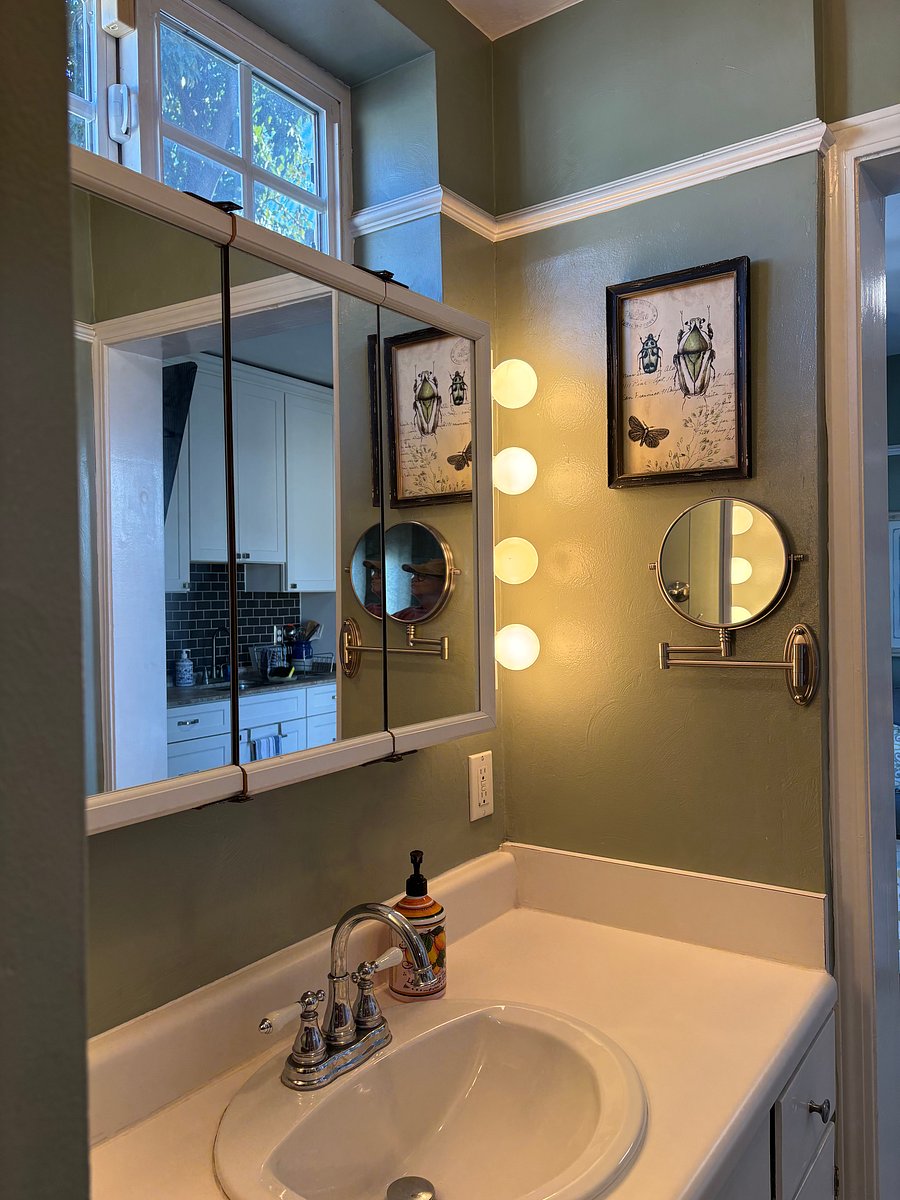 Bathroom sink with cabinet and mirror