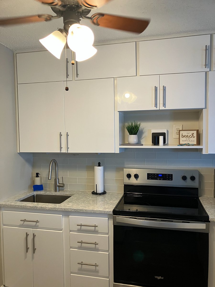 Enjoy a large sink, modern electric range, and  spacious quartz countertop perfect for meal prep or laptop work.