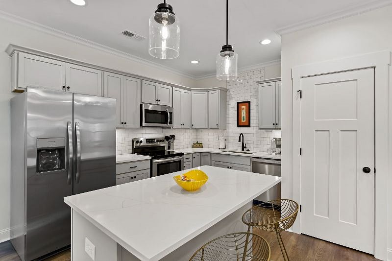 Full kitchen with Keurig and Ninja air fryer/toaster, pots, pans, cooking utensils, lots of storage and large pantry