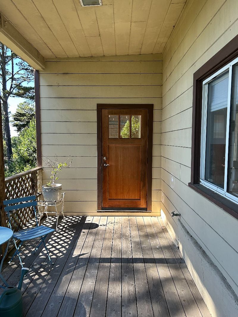 Front porch and entrance private entrance down steps from driveway/street