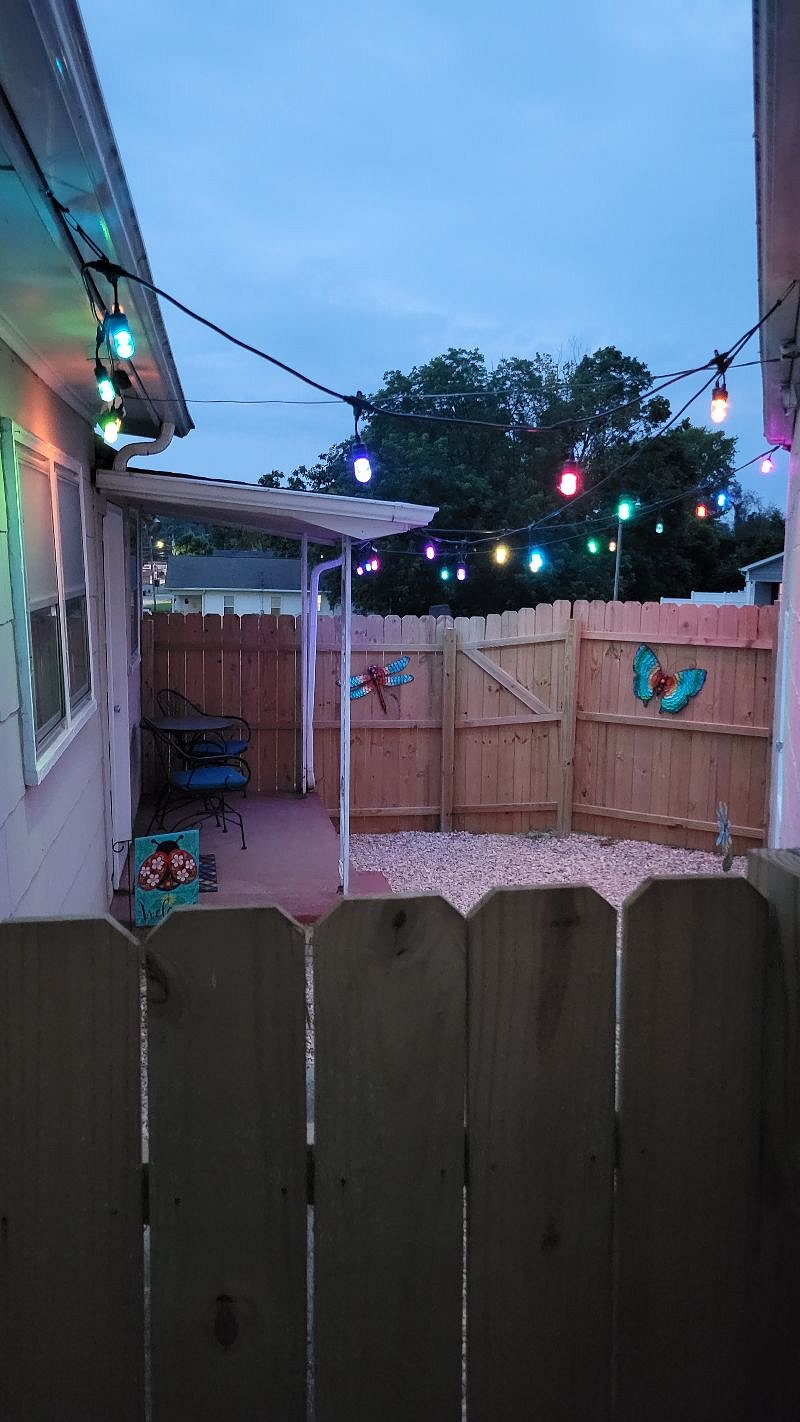 Private outdoor courtyard with multi colored LED lighting