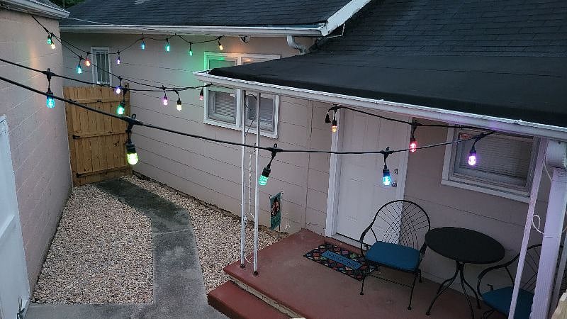 Private outdoor courtyard with multi colored LED lighting