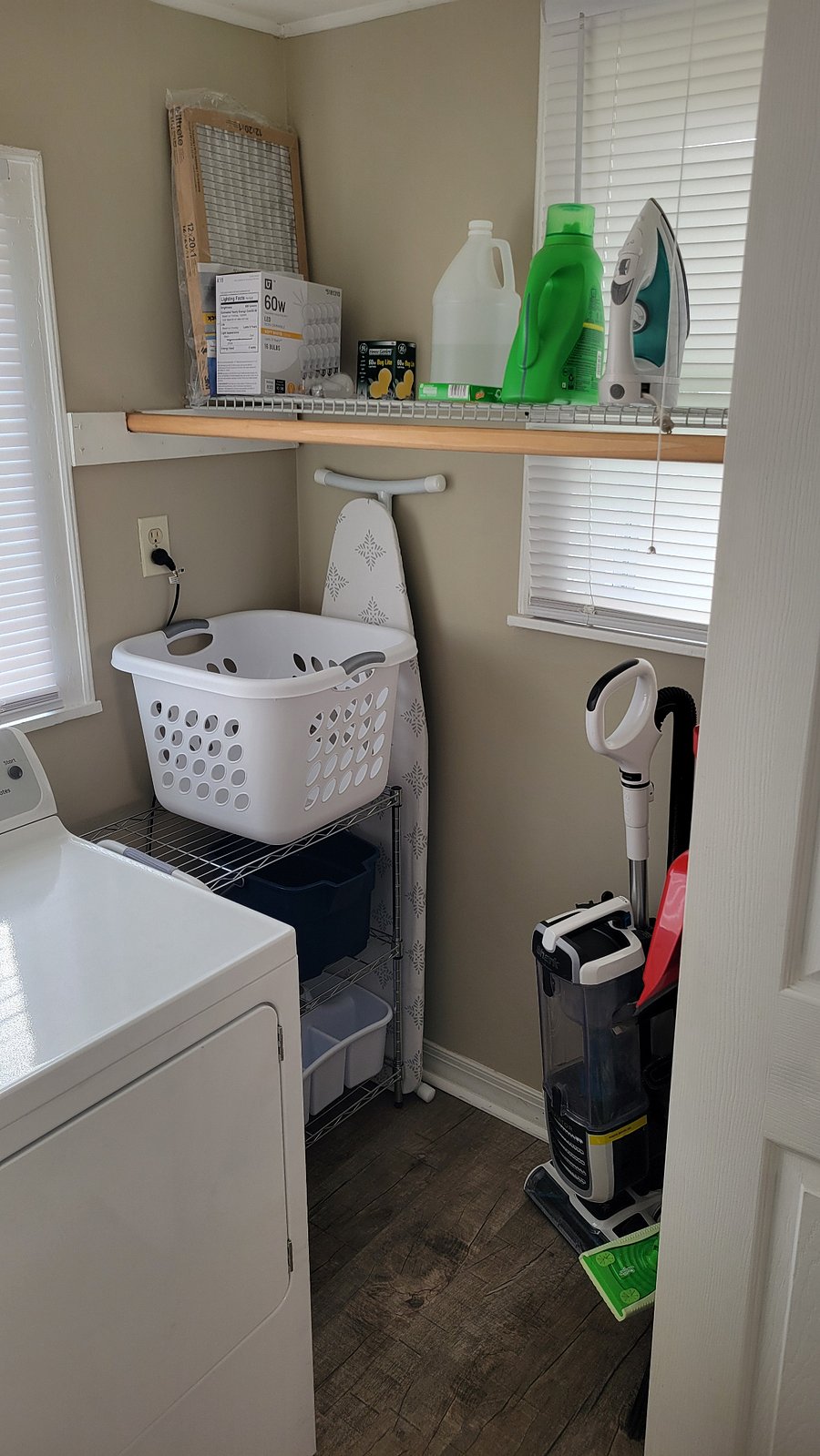 Laundry room with cleaning supplies
