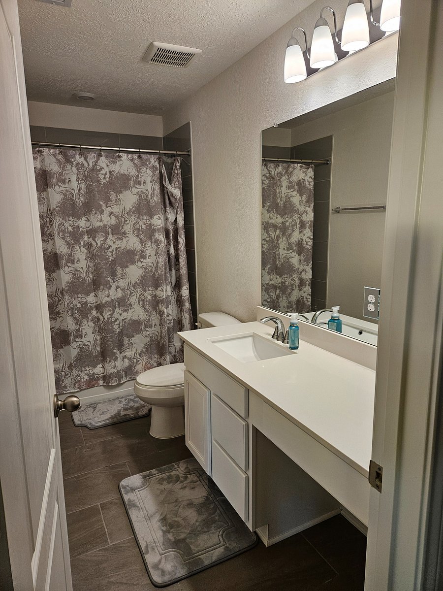 Shared upstairs restroom. There's also a half bathroom downstairs.