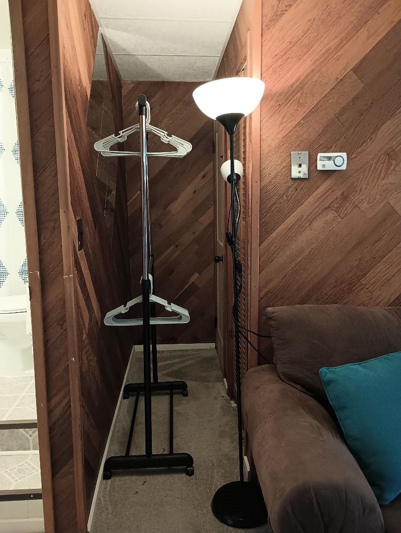 Storage nook for extra belongings, and rolling clothing rack