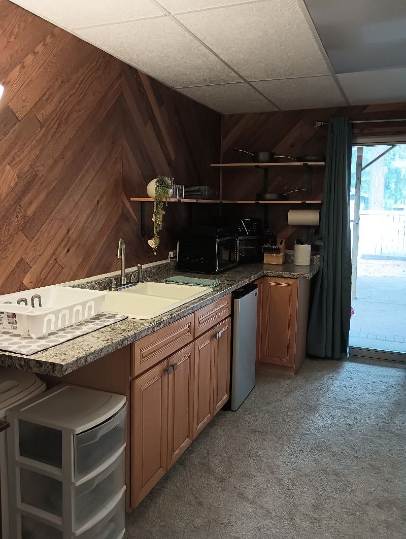 Kitchenette - full sink, mini fridge, cooking essentials and dishes