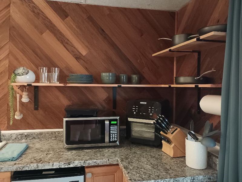 Appliances include: mini fridge, portable induction cooktop, microwave, air fryer, coffee maker. Access to shared Chest Freezer in garage.