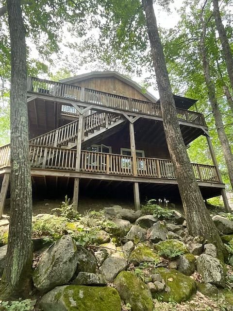 View from back of house. Upper back deck is private and yours alone. Entrance to deck from both bedrooms