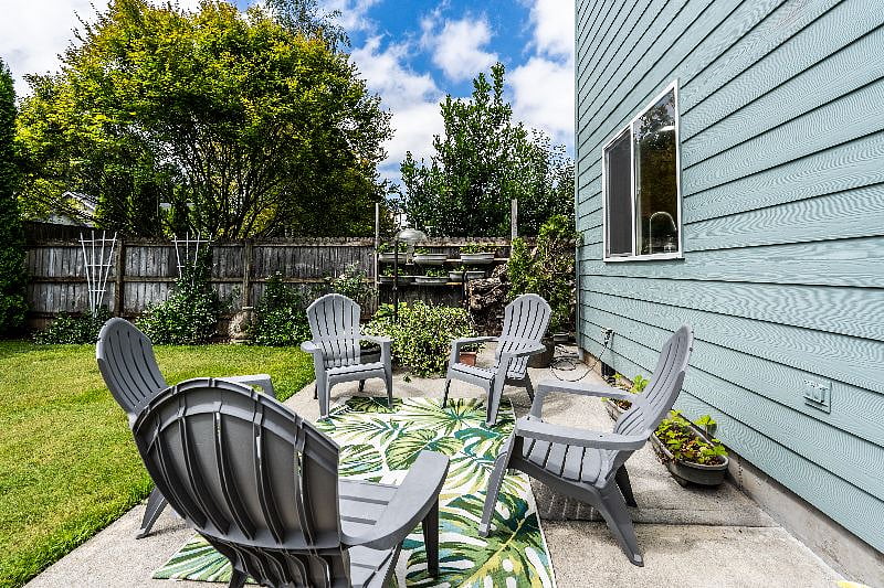 Back yard seating, with a BBQ and the use of a propane fire pit upon request.