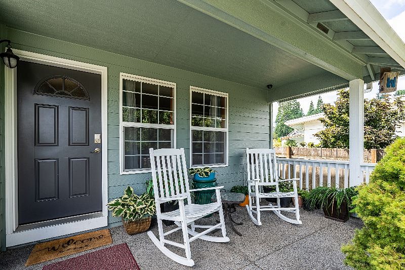 Large front porch with a fire pit available upon request. Spring and summertime birds often enjoy the fountain.