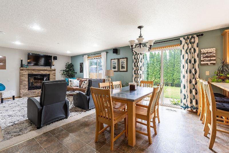Open concept kitchen, dining and family room with Smart TV.half
