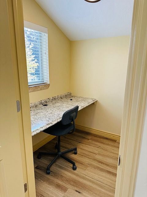 Private office workspace with a door