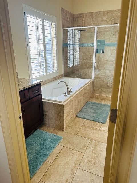 Master bathroom with a walk in closet, and separate toilet area.  The bathtub is huge, perfect for soaking in after a day of skiing.