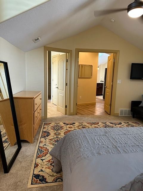 Looking out from the Master bedroom into the hallway out to the kitchen and the Master bathroom on the left