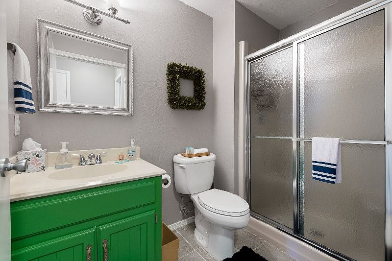Guest Bathroom with standing shower.