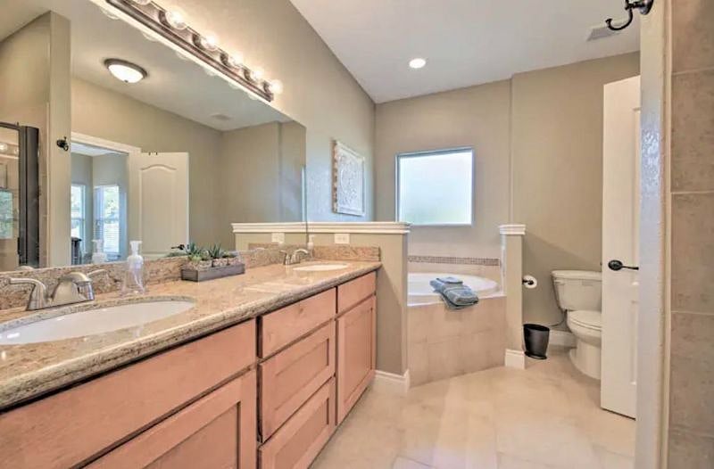 Master Bathroom. Separate Shower with Included Toiletries as well. Walk-in Master Closet Behind Camera
