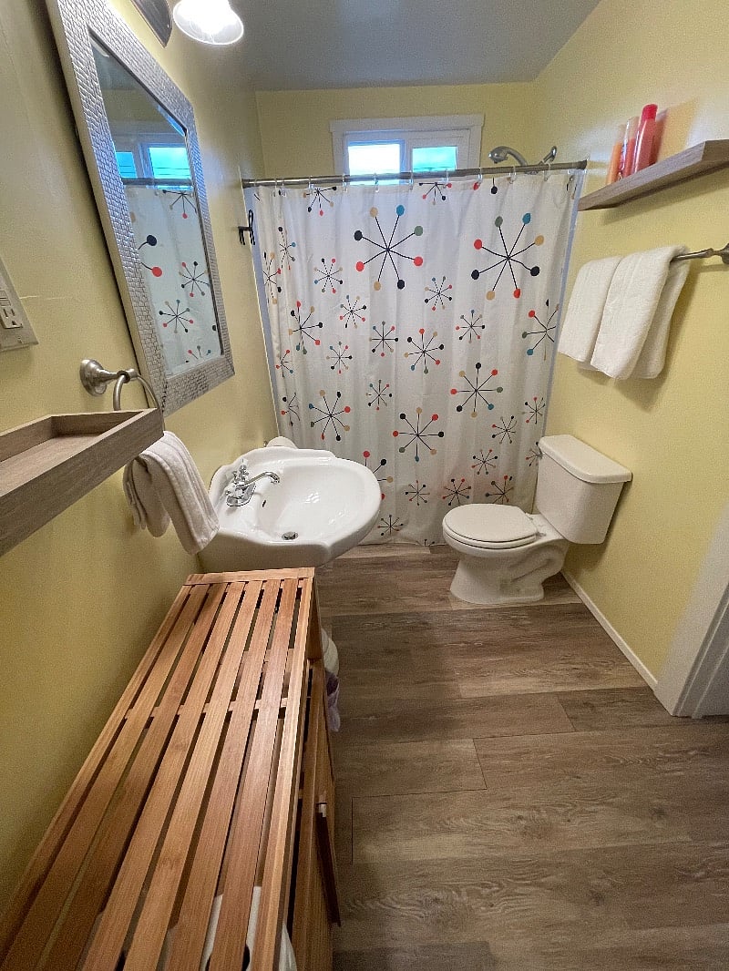 Bathroom. Plenty of clean white towels, enough TP to get you through the first week or two and basic shampoo, conditioner and body wash if needed.