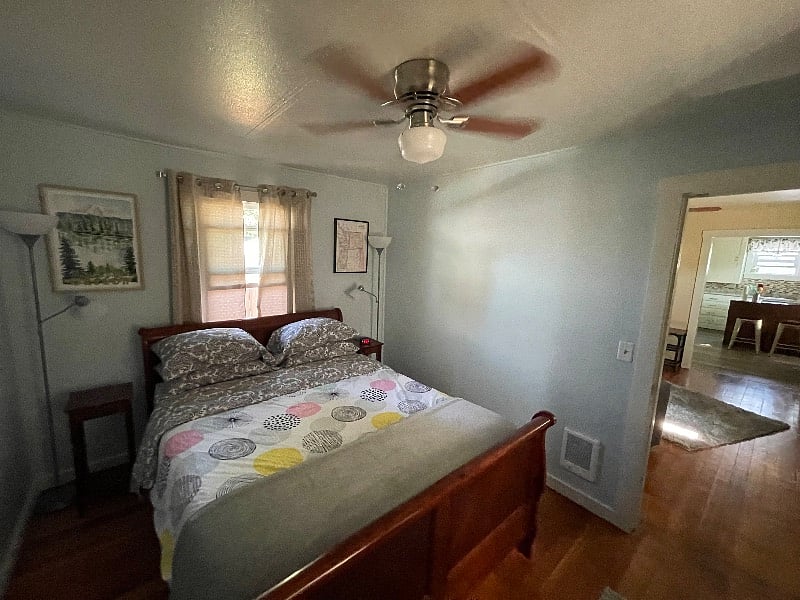 Wall heater, ceiling fan in bedroom.