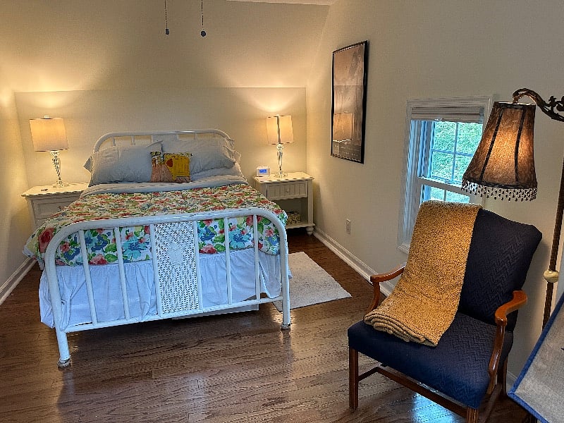 Lovely relaxing bedroom with skylite and windows bringing in outdoor light. Full closet for ample storage