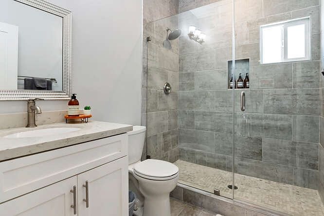 Bathroom with walk-in shower.