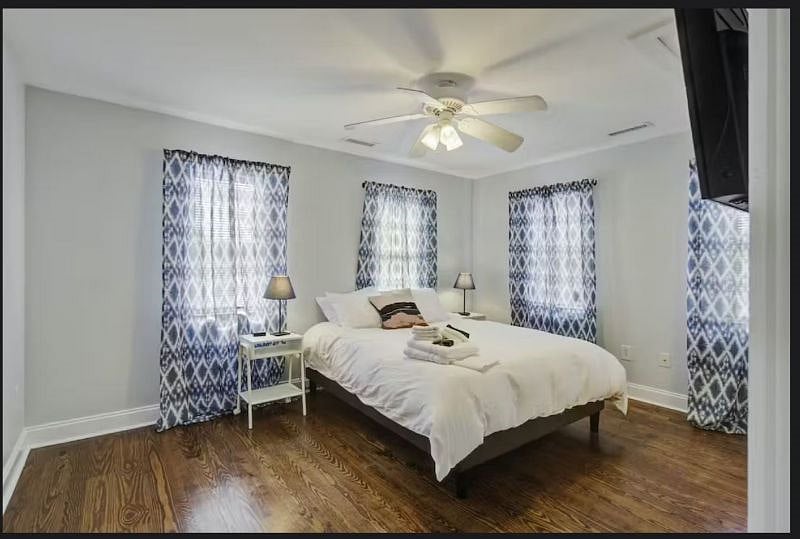 Private master suite offering a peaceful retreat with Smart TV, en-suite bathroom,  queen sized bed, double closets and work station. 