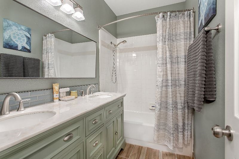 Hallway Full Bathroom (#2): New dual vanity cabinet with marble counter, new mirror, auto-sensing bathroom vent