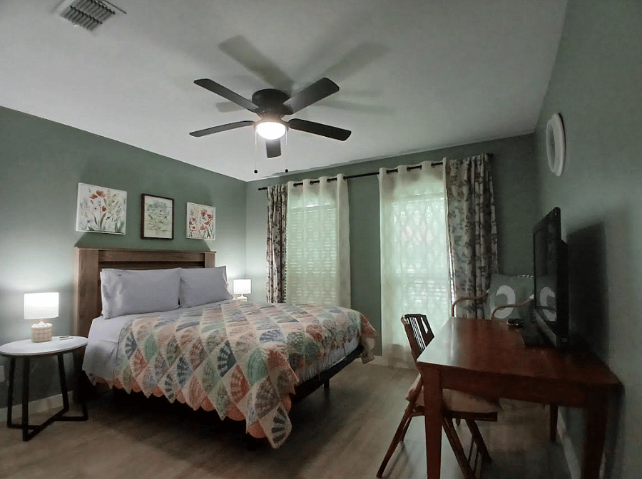 Good size secondary bedroom (#2) on the other side of the house from master; TV & Writing Desk (#2) added to this room.