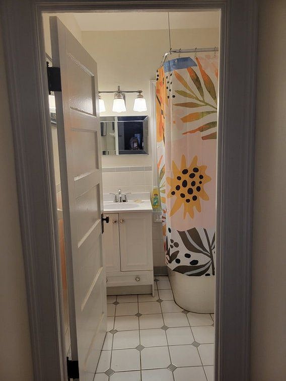 Tiled bathroom, full tub and shower Towles provided